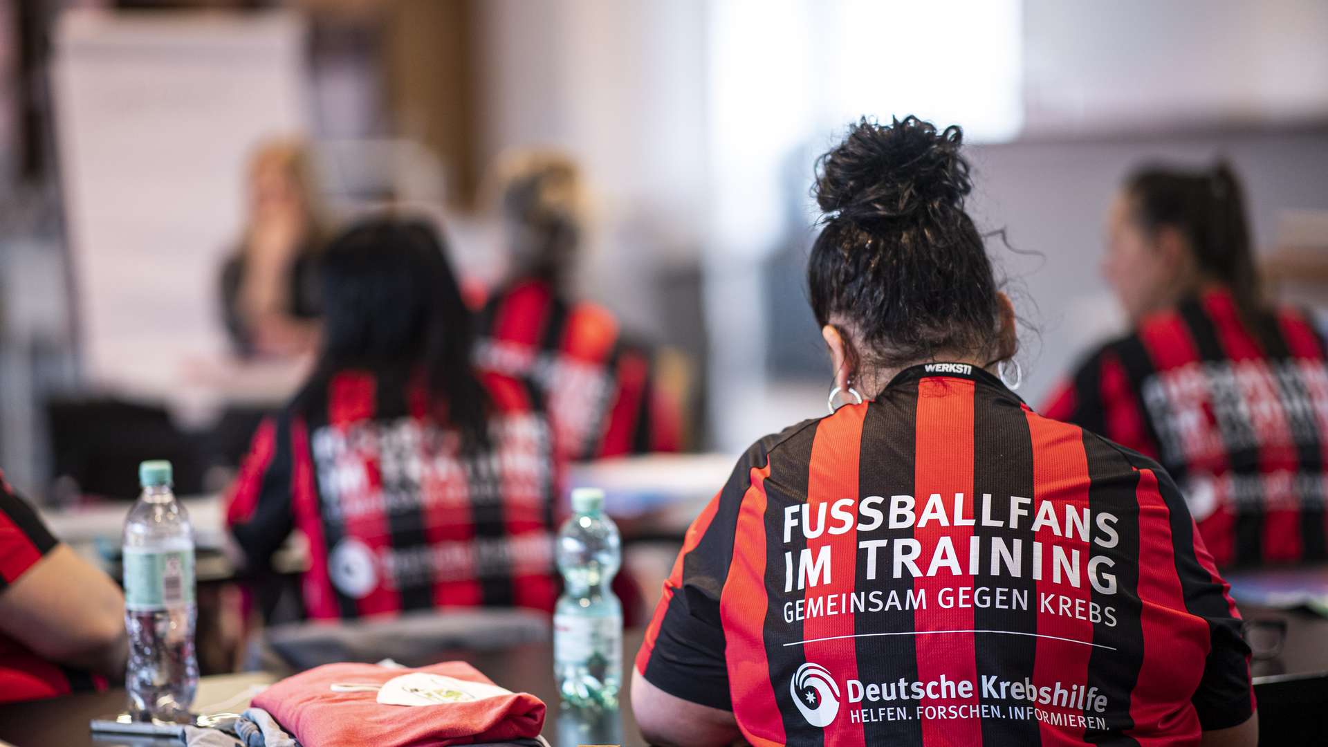 woman football fans at training