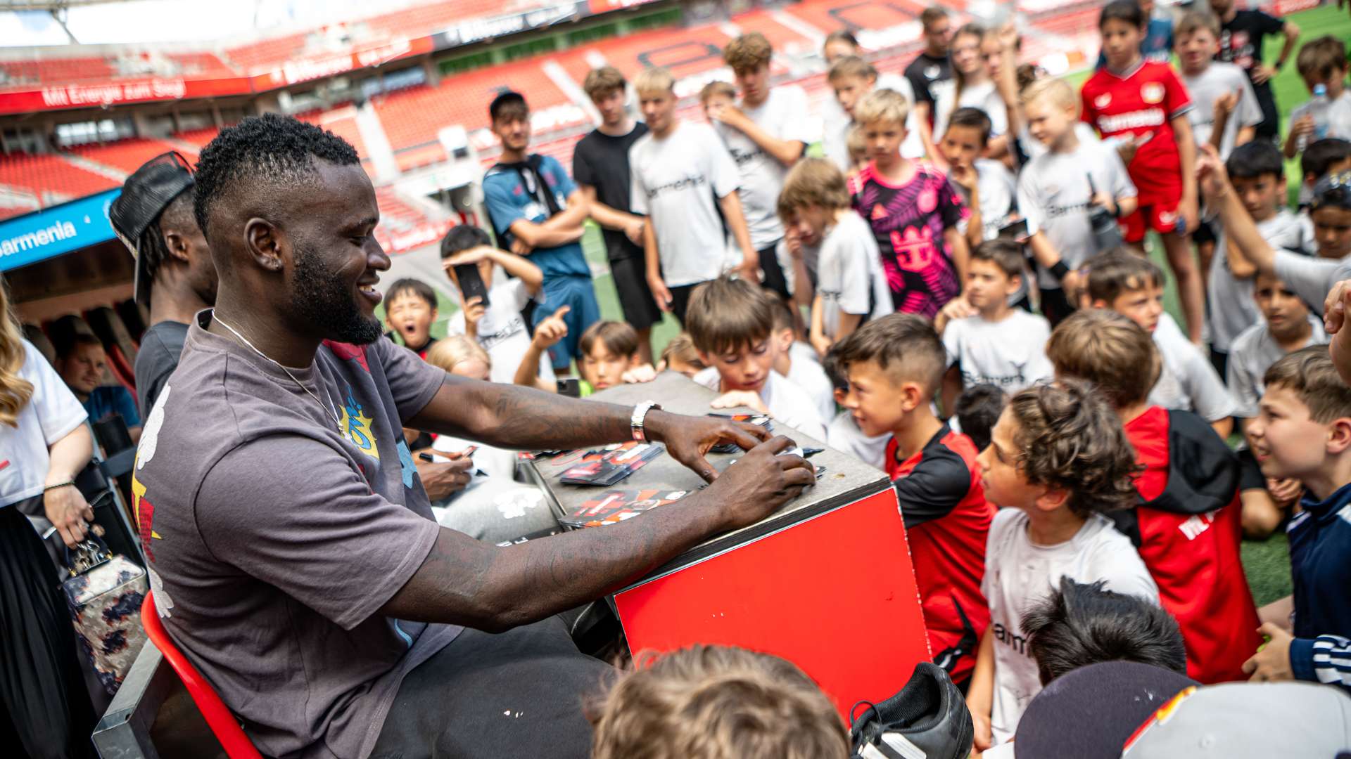 Victor Boniface and Odilon Kossounou at the Bayer 04 Football School