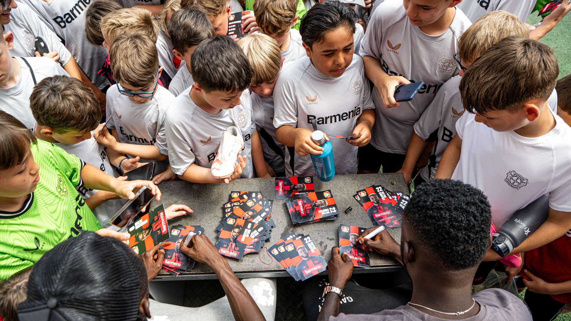 Victor Boniface and Odilon Kossounou at the Bayer 04 Football School