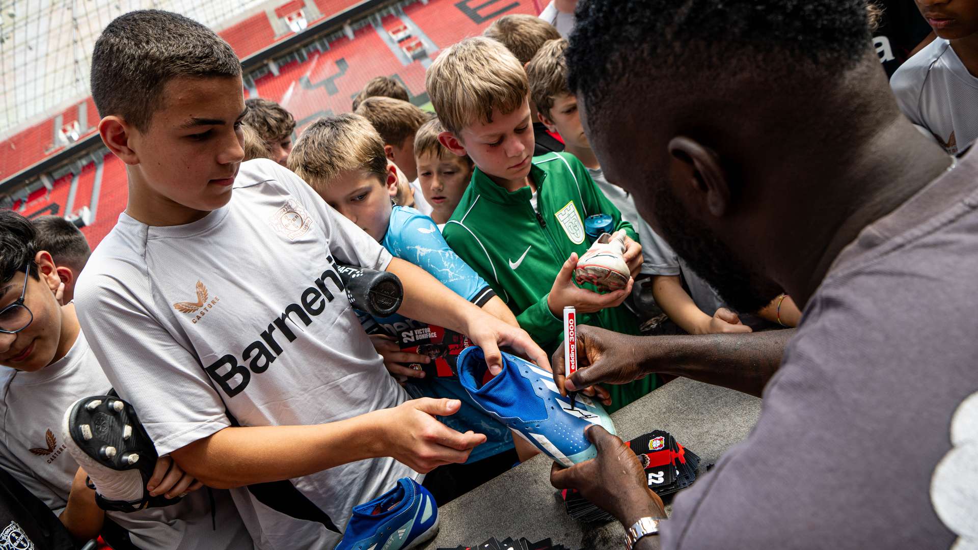 Victor Boniface and Odilon Kossounou at the Bayer 04 Football School