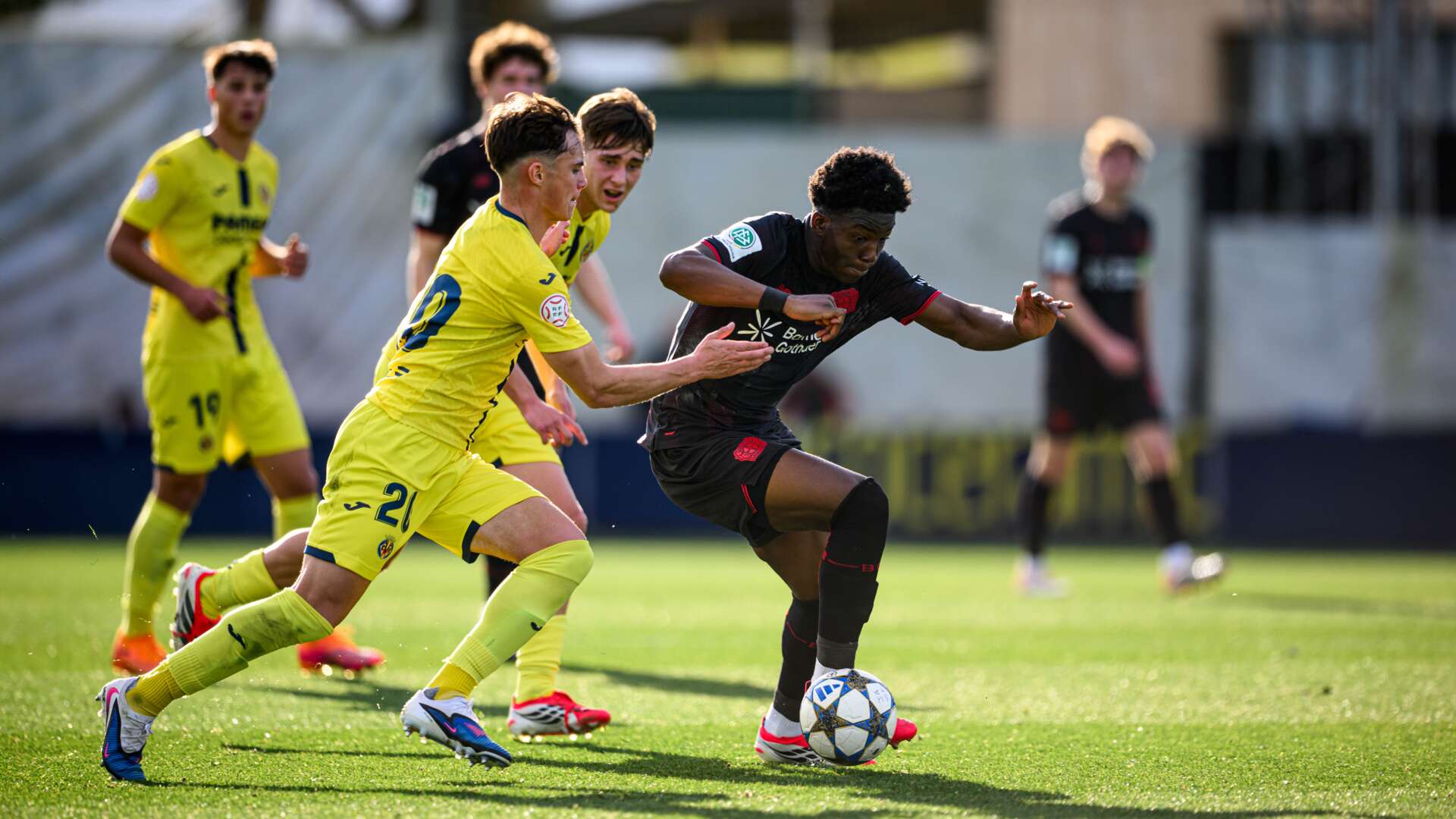 Axel Tape retains the ball in the centre